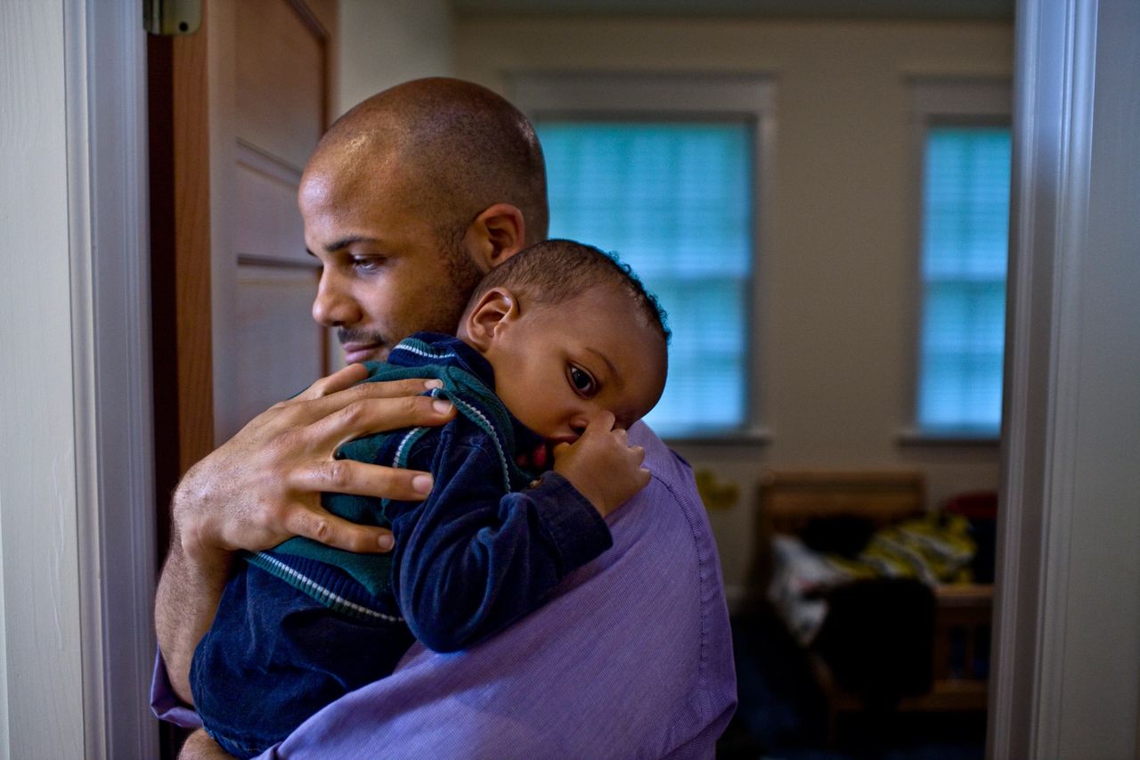 Father hugging baby | The language of infant safety.